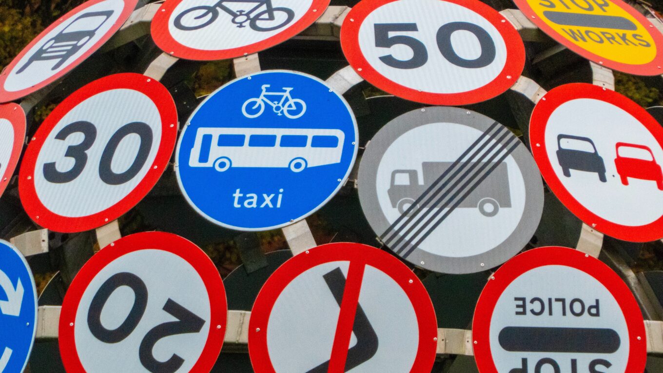 Road signs bolted to a circular frame
