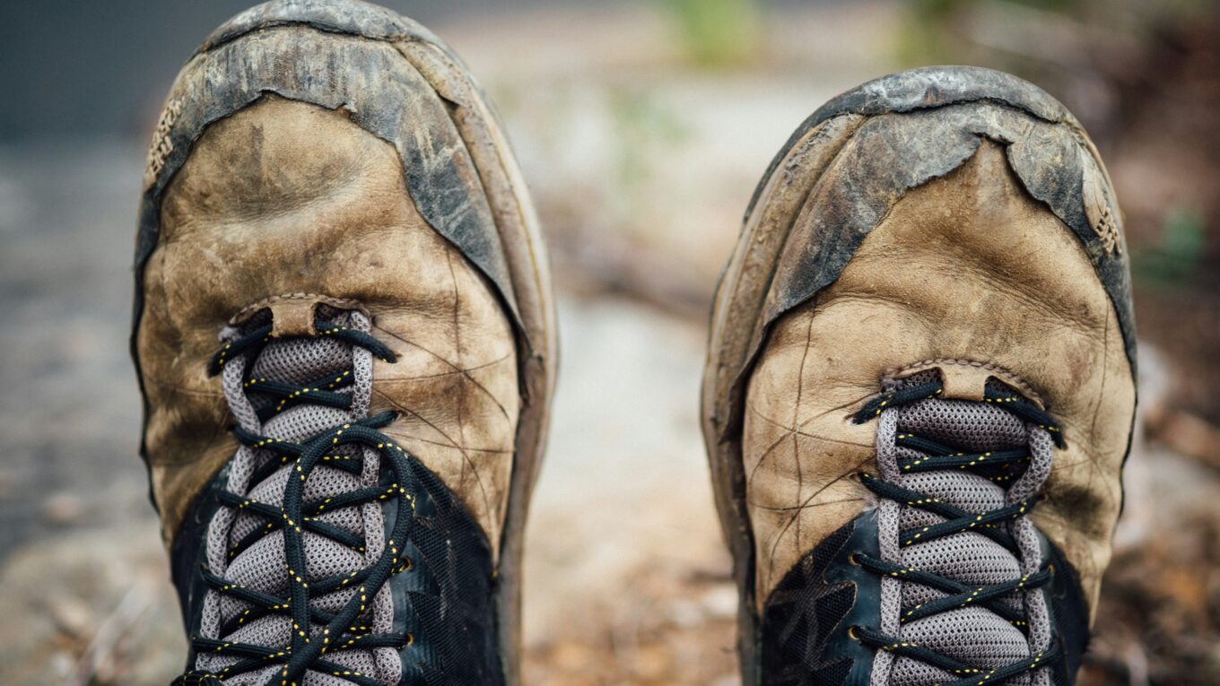 Close up of brown, muddy walking boots